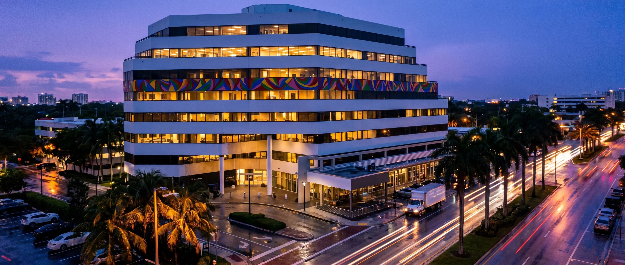 Synergy — 12000 Biscayne, North Miami (rendered aerial after the site photograph)